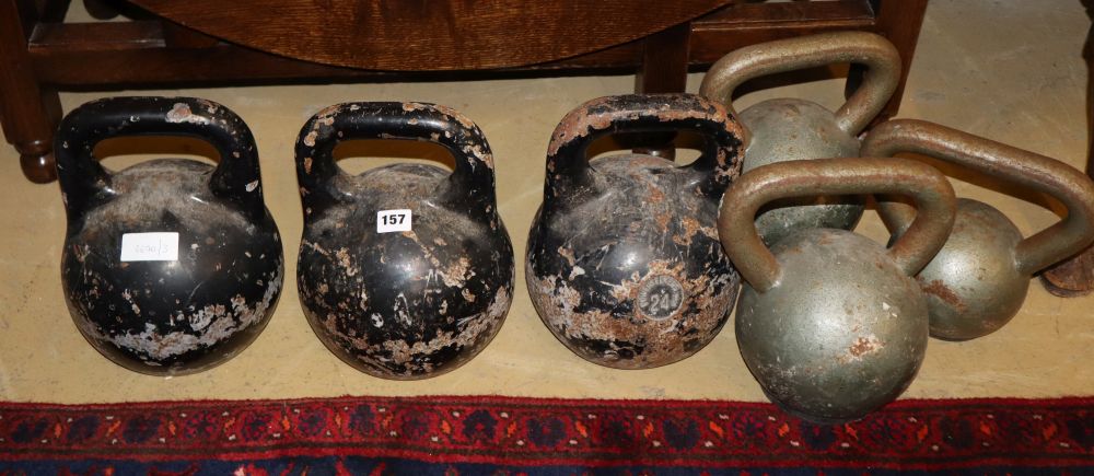Six vintage cast metal kettle bell weights